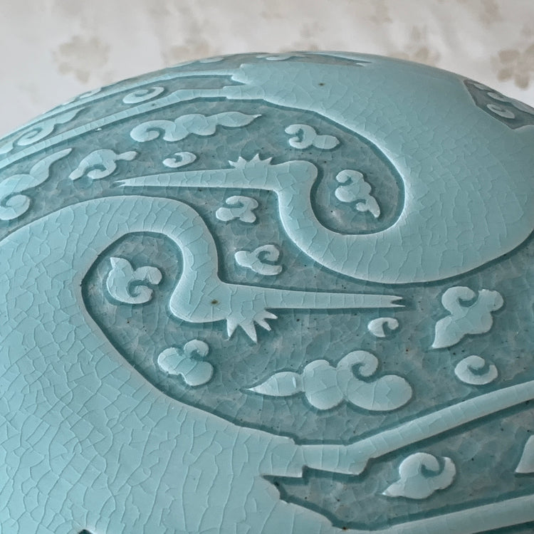 Large handmade celadon box with an intricate crane and cloud pattern, exemplifying traditional Korean artistry and elegance.