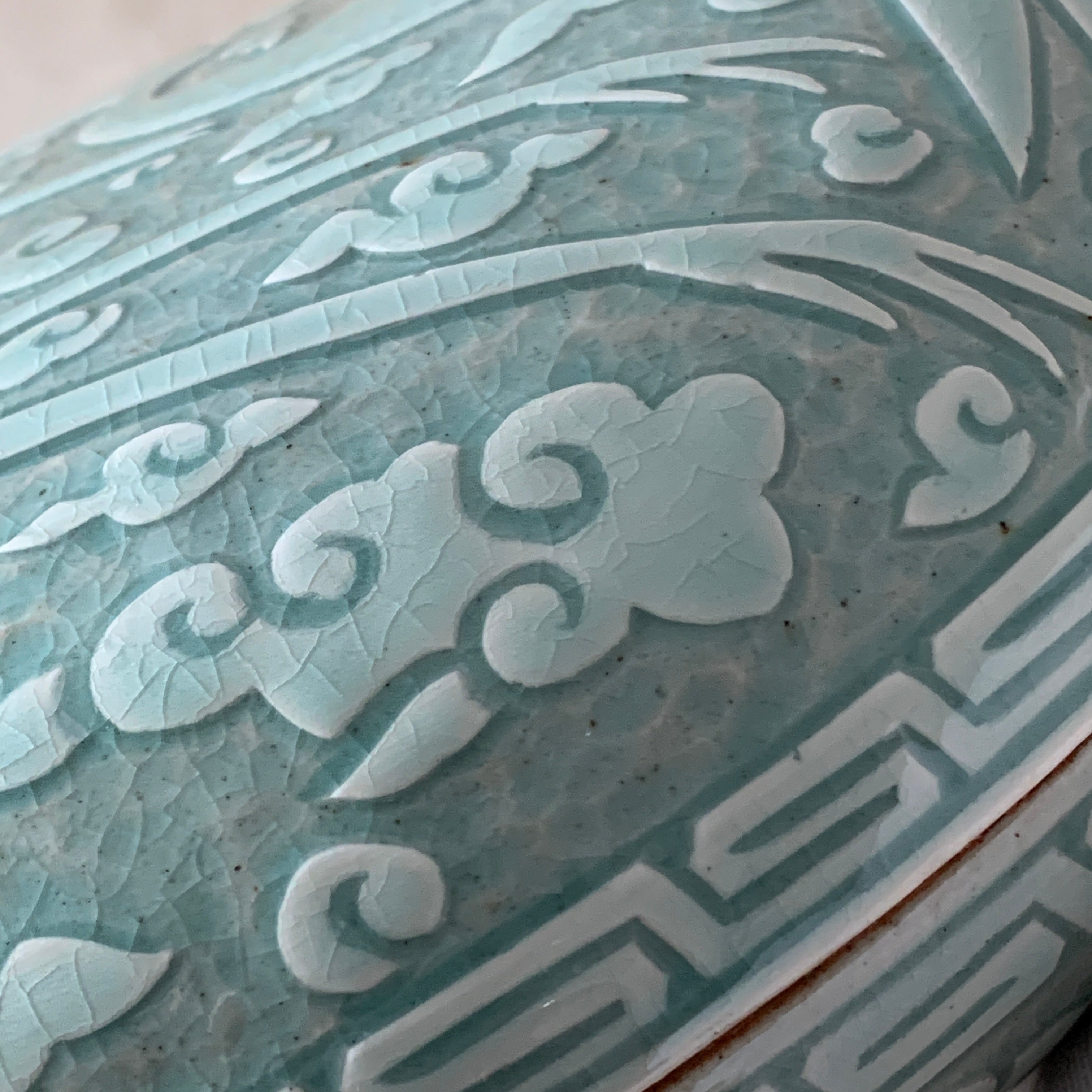 Large handmade celadon box with an intricate crane and cloud pattern, exemplifying traditional Korean artistry and elegance.