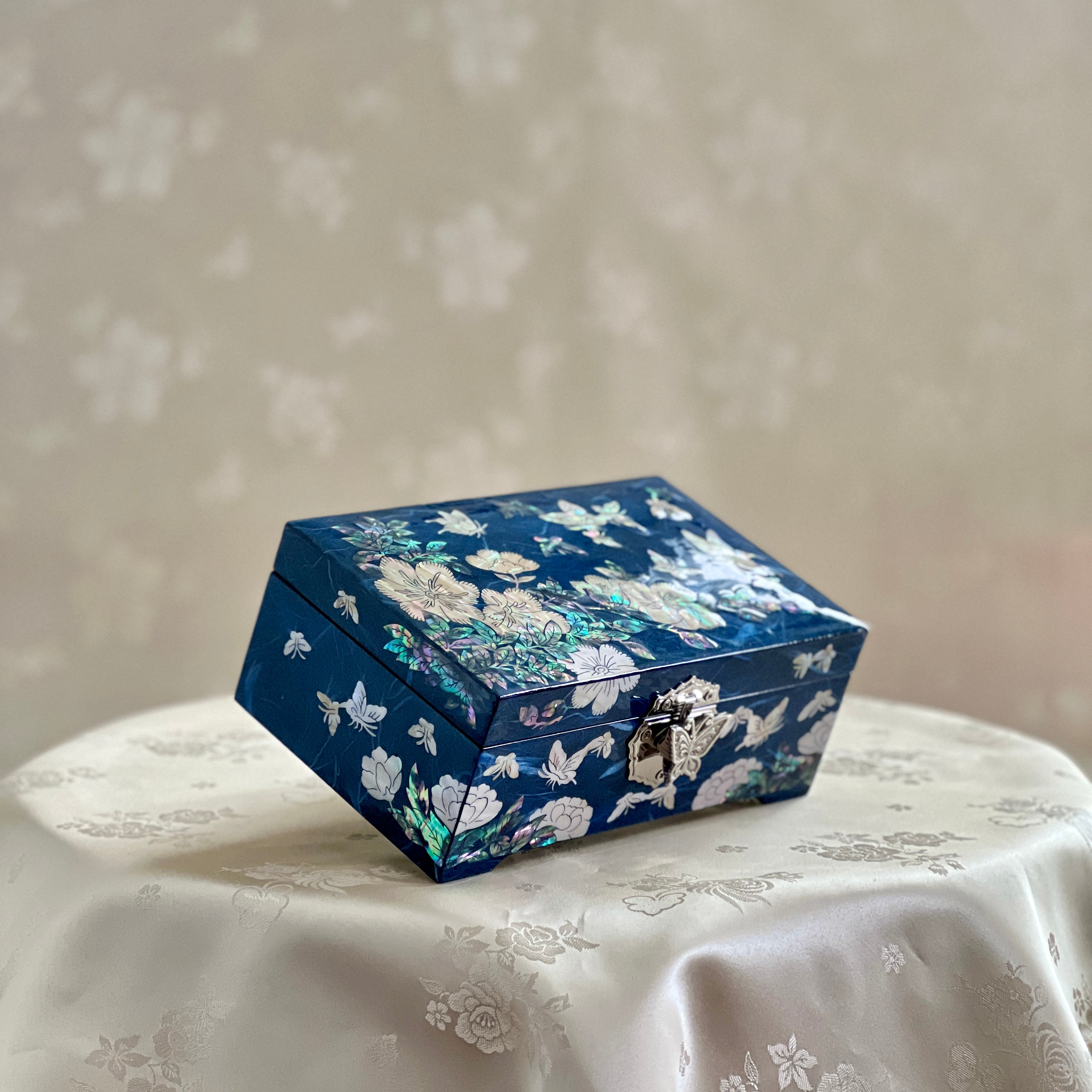 Side, front and upper view of Handmade Korean mother of pearl jewelry box with crane and pine pattern on navy paper-layered design, perfect for storing valuable jewelry.