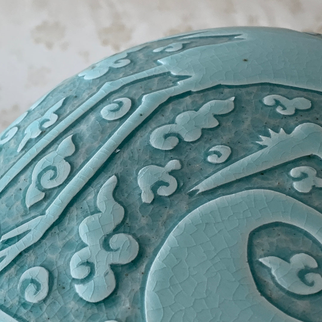 Large handmade celadon box with an intricate crane and cloud pattern, exemplifying traditional Korean artistry and elegance.