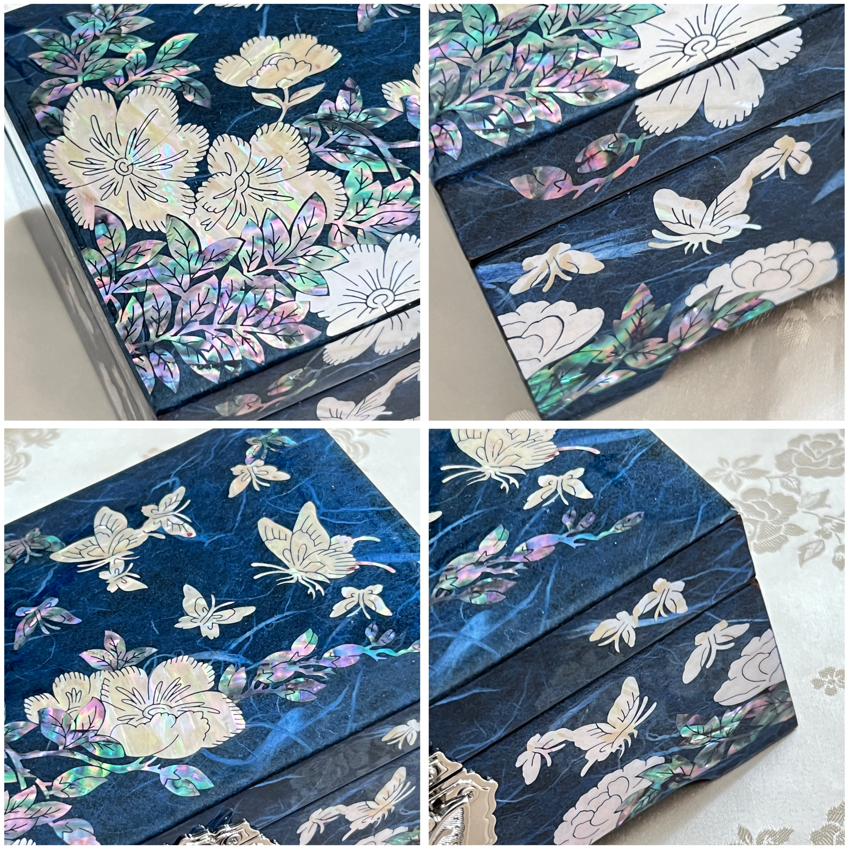 Close up view of Handmade Korean mother of pearl jewelry box with crane and pine pattern on navy paper-layered design, perfect for storing valuable jewelry.