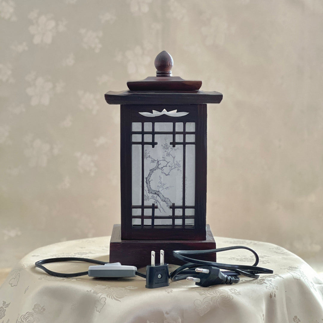 Front view of a handmade Korean traditional wooden table lamp with a square pagoda-shaped roof and Sagunja patterns. including plug and switch