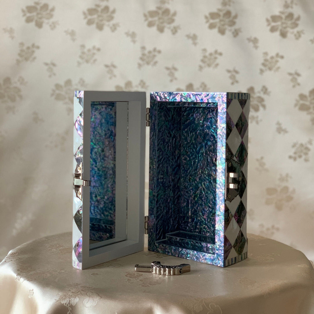 Detailed open view showing the interior and reflective shell lining of the handmade Korean mother of pearl and cheongpae wooden jewelry box.